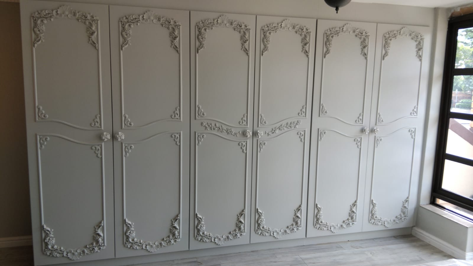 Custom designed built-in wardrobe with moulding details in Centurion