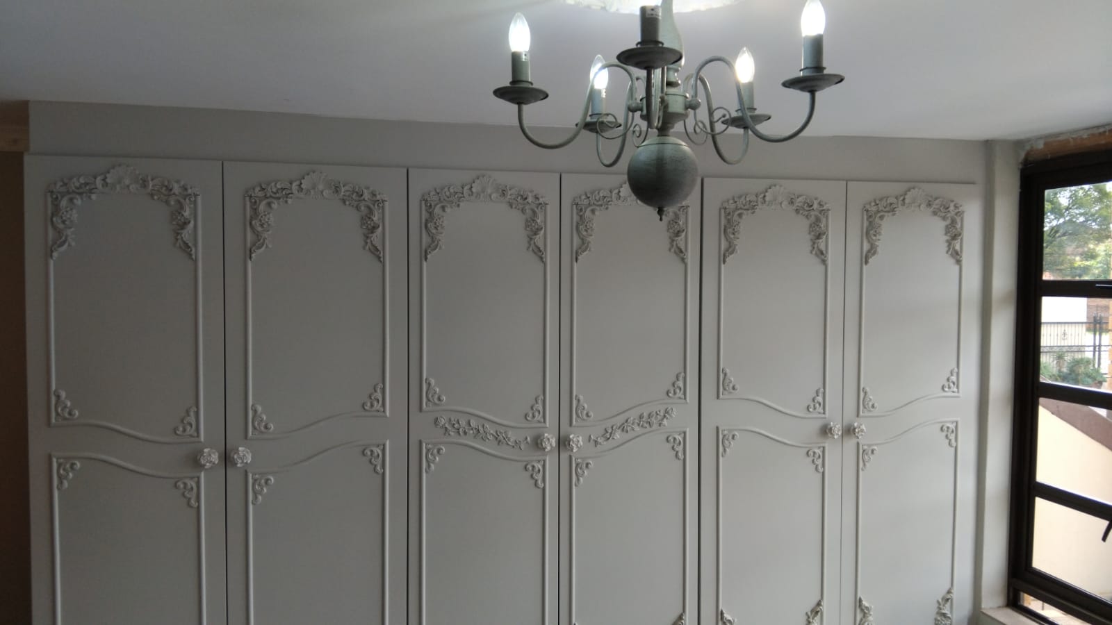 Custom designed built-in wardrobe with moulding details in Centurion