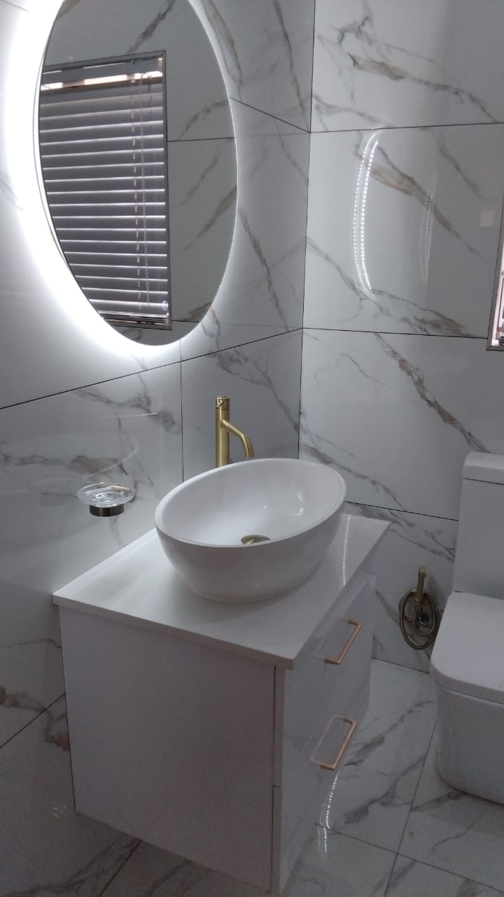 Light marble bathroom renovation Garsfontein